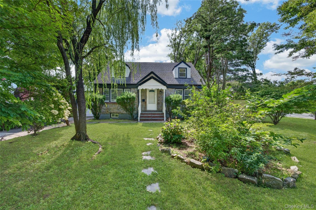 Photo of 343 Sylvan Lane, Westbury, NY 11590 (MLS # 1066918)