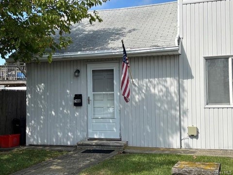 Photo of 74 Radcliffe Road Road #Left, Island Park, NY 11558 (MLS # 1010124)
