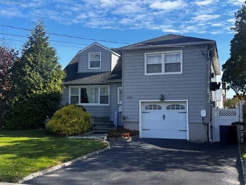 Photo of 208 Island Parkway W, Island Park, NY 11558 (MLS # 936224)