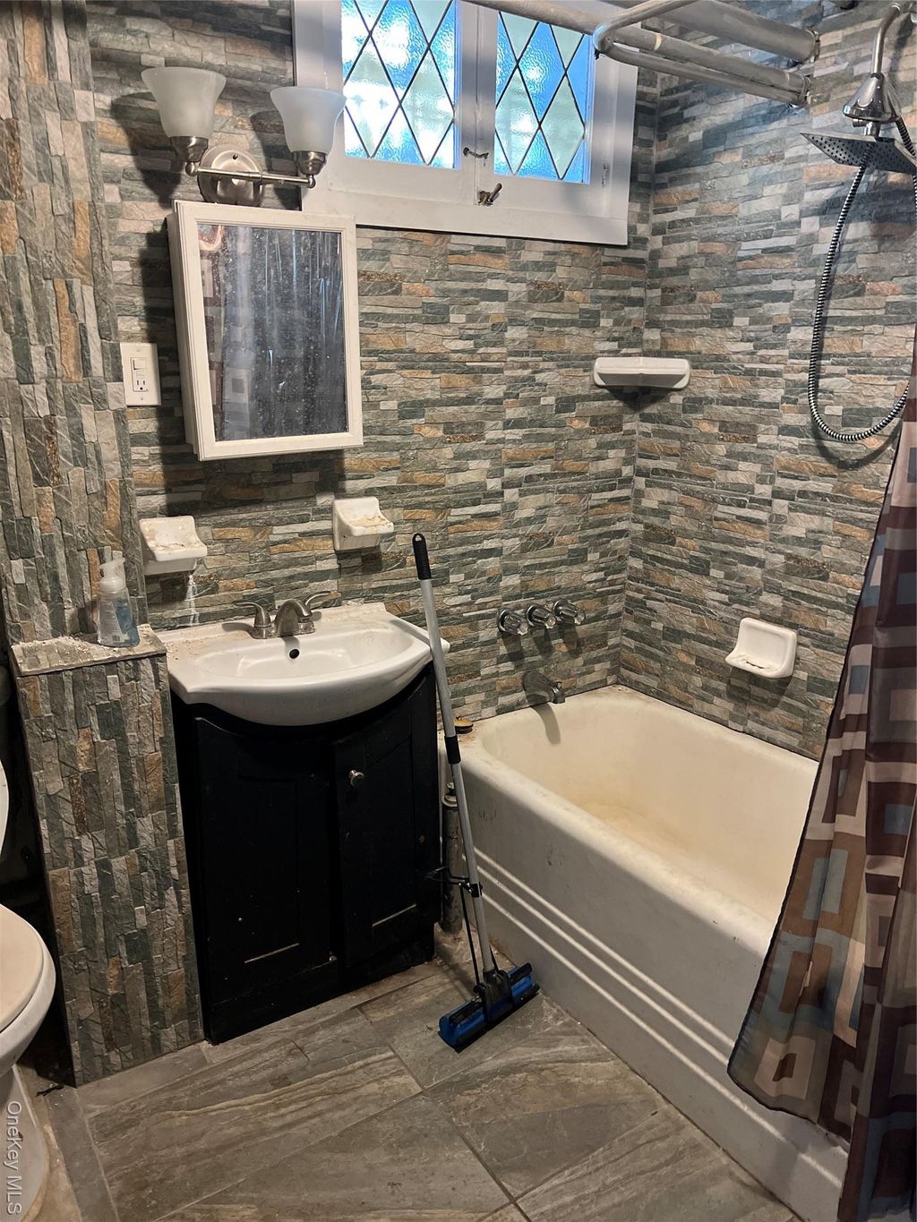 Photo of 104-40 114th Street, Jamaica, NY 11419 (MLS # 945884)