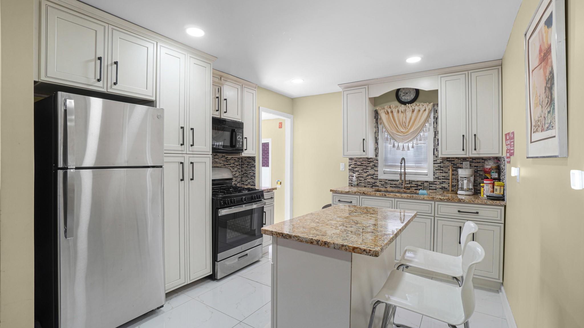 74 Locustwood Boulevard, Elmont, New York image 7