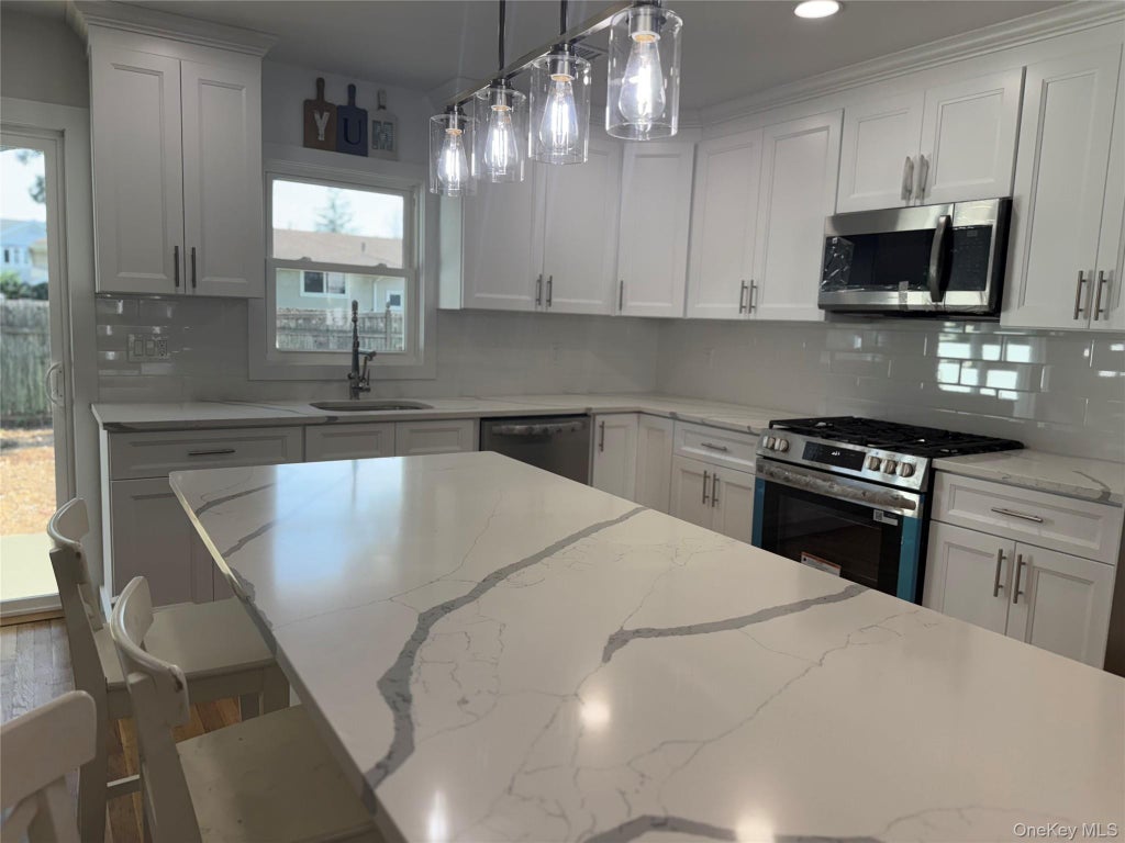 Photo of 2 5th Avenue, Farmingdale, NY 11735 (MLS # 1030798)
