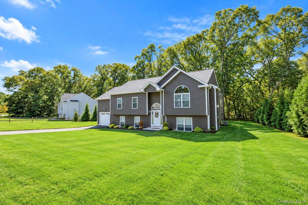Photo of 77 Maple Wood Lane, Riverhead, NY 11901 (MLS # 1057678)
