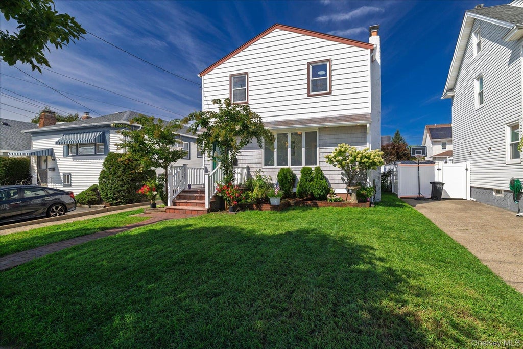 Photo of 48 W Windsor Parkway, Oceanside, NY 11572 (MLS # 1049001)