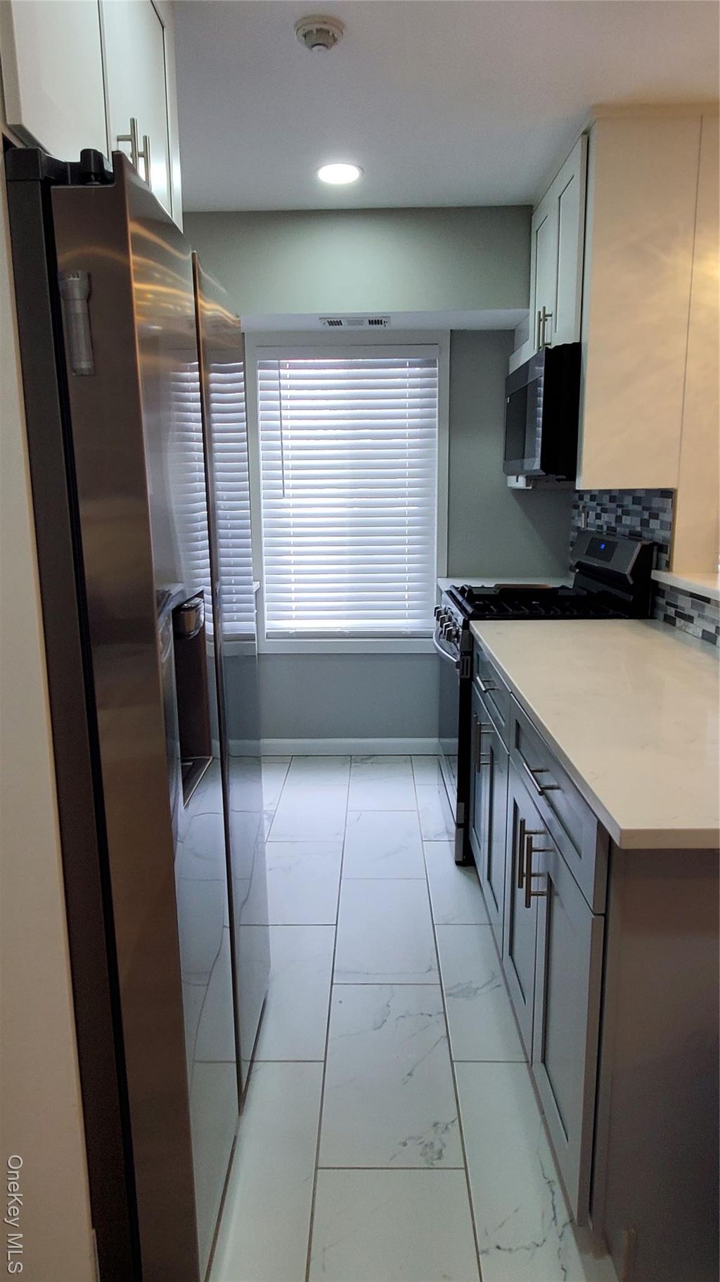 Photo of 11 Idaho Ct #11, Coram, NY 11727 (MLS # 963054)