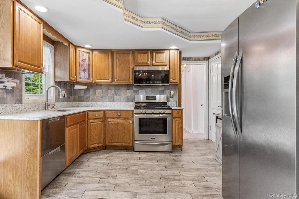 Photo of 84 Barnum Street, West Babylon, NY 11704 (MLS # 1030918)