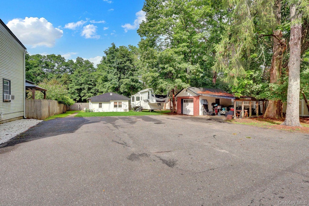 Photo of 7 Mooney Pond Road, Coram, NY 11727 (MLS # 1045948)