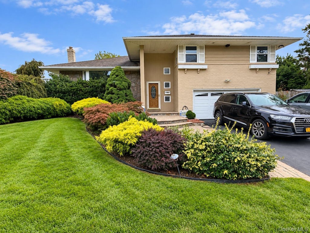 Photo of 68 Hazelwood Drive, Jericho, NY 11753 (MLS # 1055386)