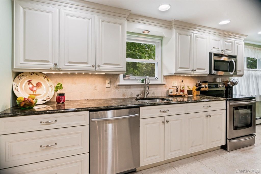 Photo of 16 Bruce Drive, South Setauket, NY 11720 (MLS # 1020777)
