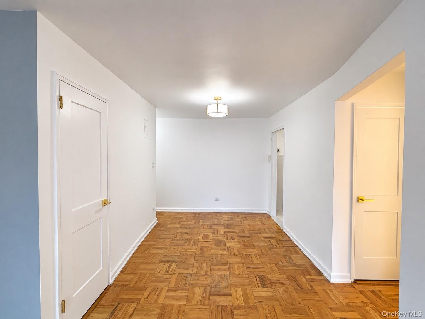 Bedroom with a closet, light wood-type flooring, and a textured ceiling
