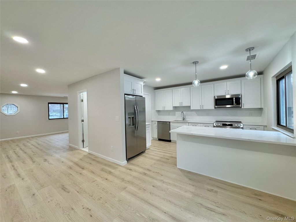 Photo of 46 Blue Point Road E, Holtsville, NY 11742 (MLS # 963511)