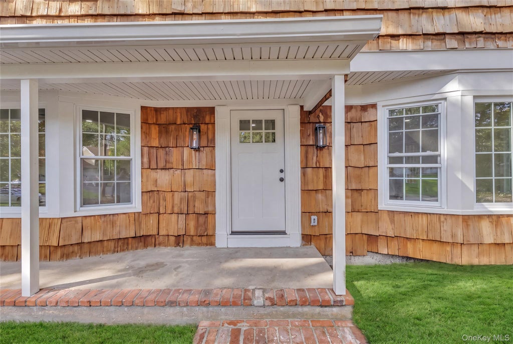 Photo of 7 Woodland Road, Miller Place, NY 11764 (MLS # 1061464)