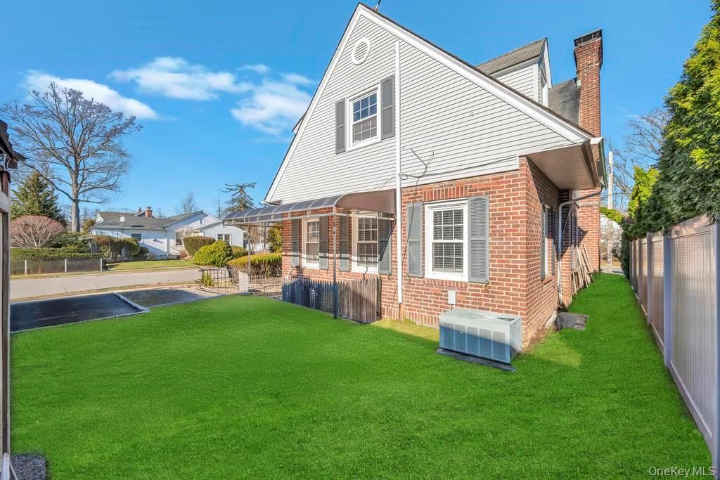 Photo of 345 Plainfield Street, Westbury, NY 11590 (MLS # 976179)