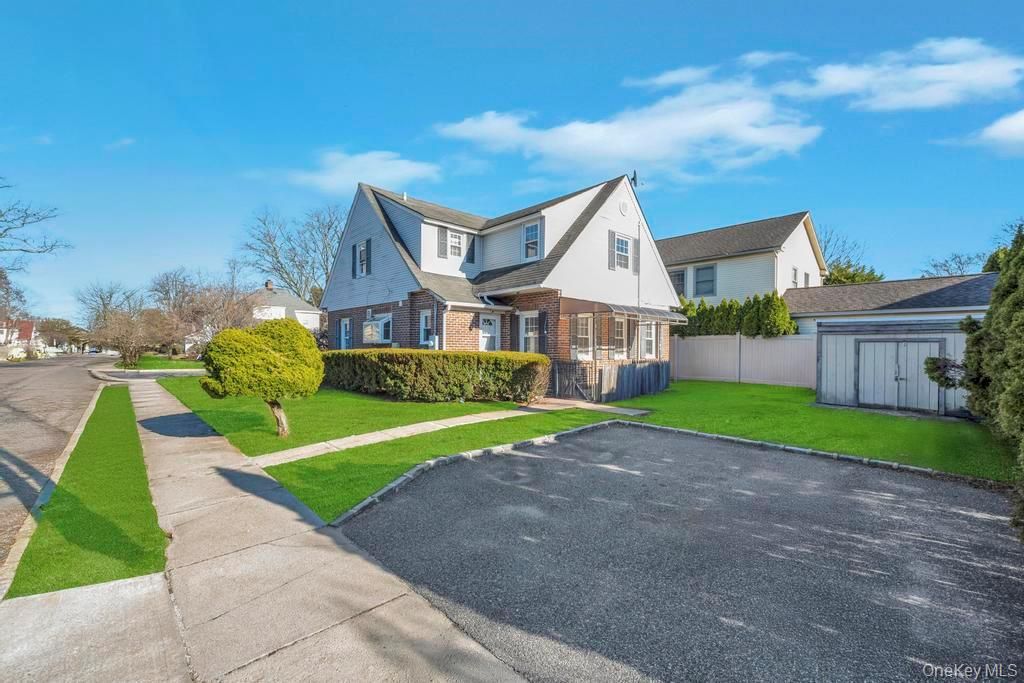 Photo of 345 Plainfield Street, Westbury, NY 11590 (MLS # 976179)