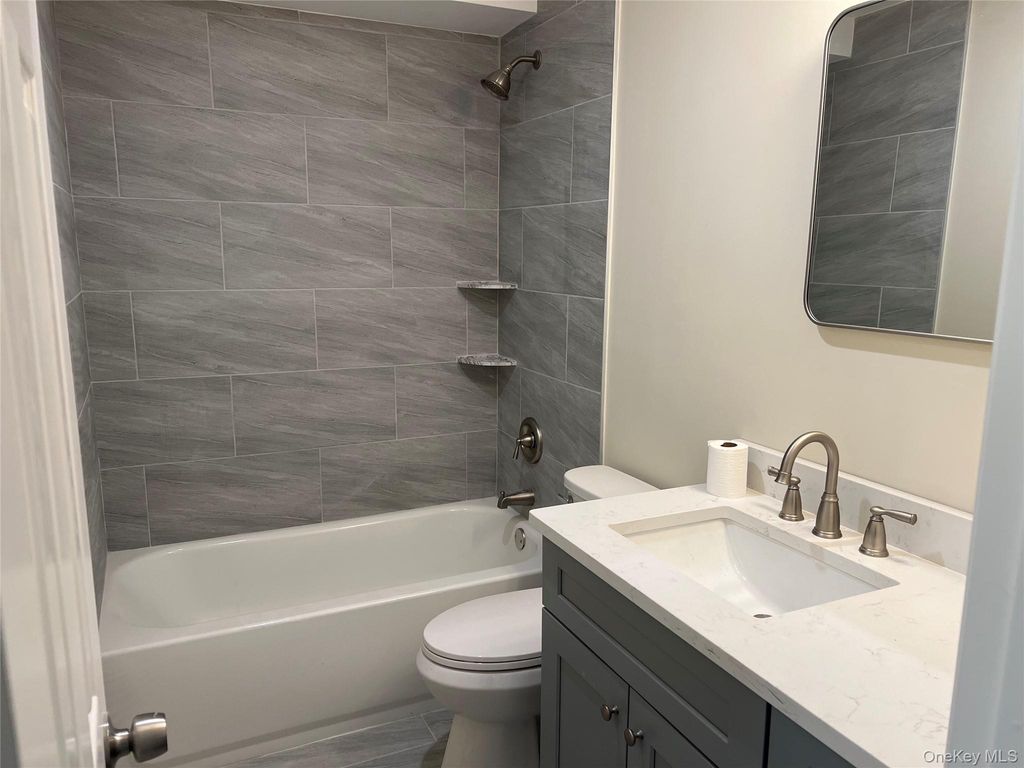 Photo of 43 Springwood Drive, North Babylon, NY 11703 (MLS # 944408)