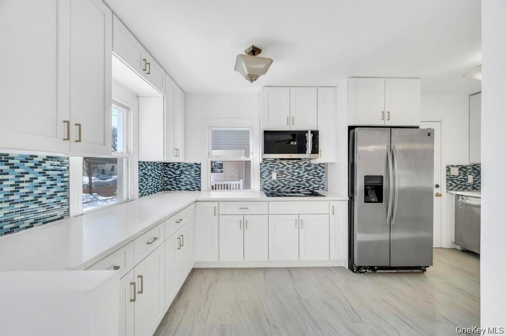 Photo of 627 10th Avenue, New Hyde Park, NY 11040 (MLS # 995825)