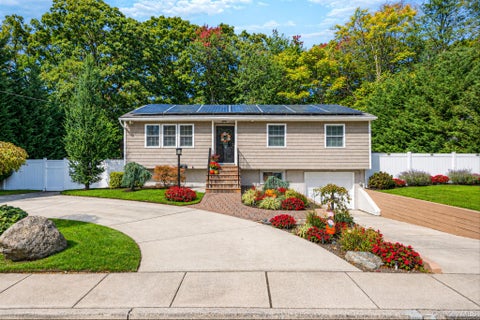 Photo of 47 Mooney Pond Road, Selden, NY 11784 (MLS # 1060215)