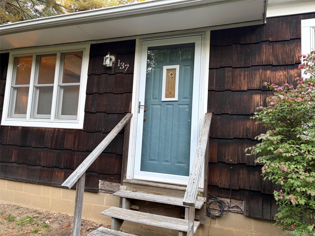 Photo of 137 Panamoka Trail, Ridge, NY 11961 (MLS # 1066485)