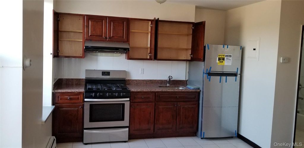 Photo of 10515 Jamaica Avenue, Richmond Hill, NY 11418 (MLS # 994335)