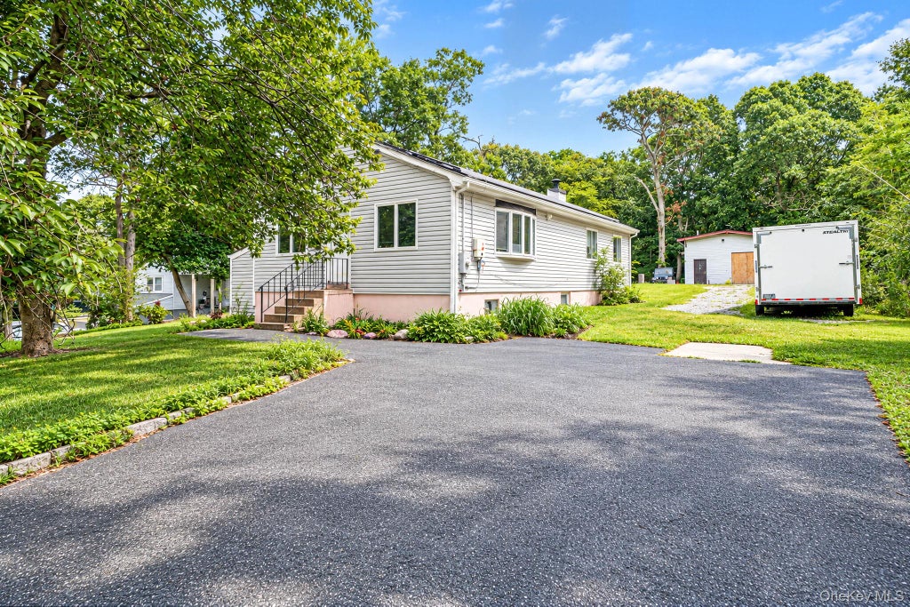 Photo of 95 W Bartlett Road, Middle Island, NY 11953 (MLS # 1056935)