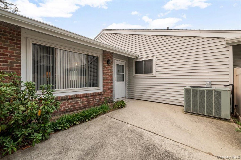 Photo of 221 Springmeadow Drive #J, Holbrook, NY 11741 (MLS # 1027712)