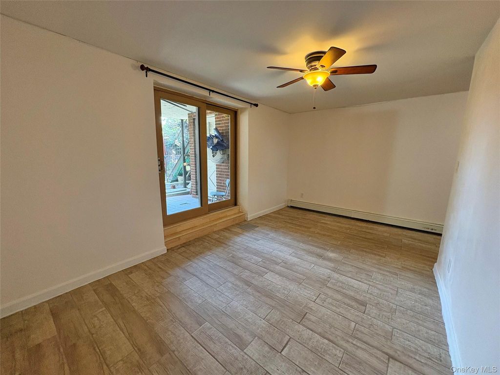 Photo of 61-33 69th St St #1st Fl, Middle Village, NY 11379 (MLS # 986263)