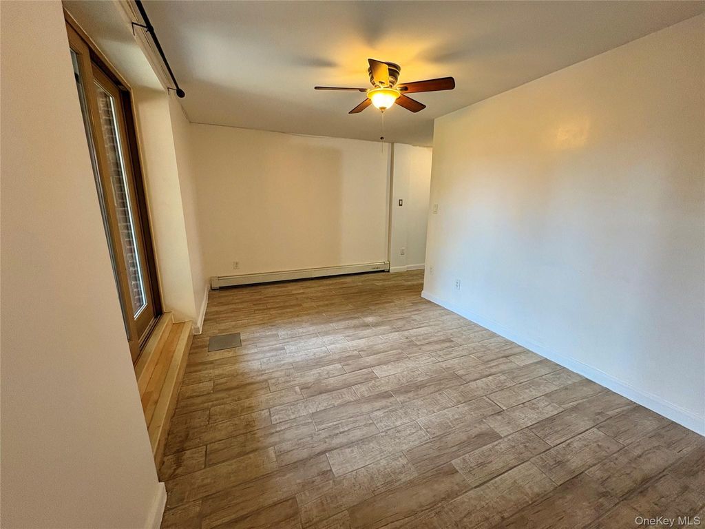 Photo of 61-33 69th St St #1st Fl, Middle Village, NY 11379 (MLS # 986263)