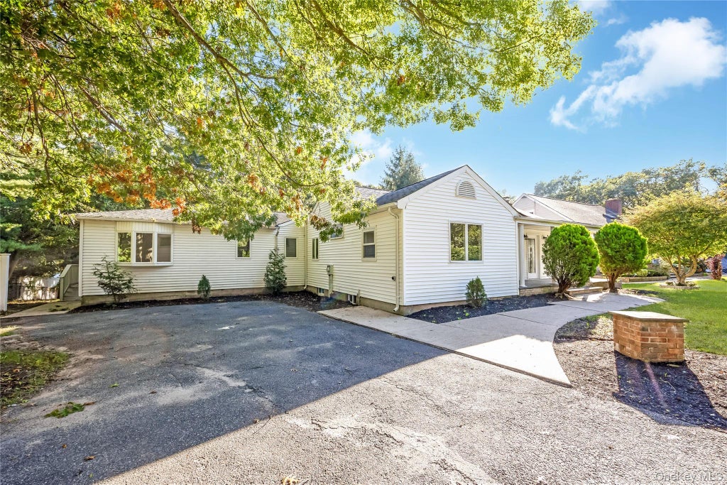 Photo of 52 Rexmere Avenue, Farmingville, NY 11738 (MLS # 1054892)