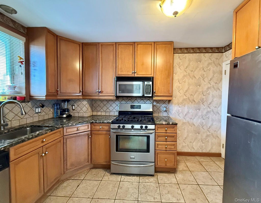Photo of 6354 77th Street, Middle Village, NY 11379 (MLS # 1033487)