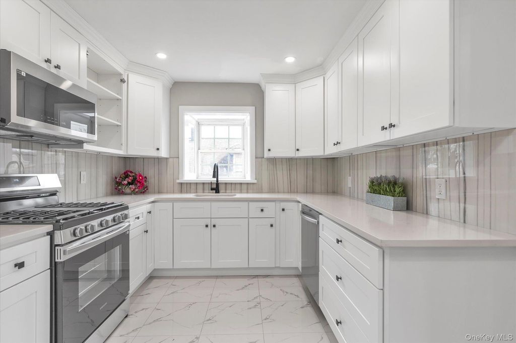 Photo of 57 E Clinton Avenue, Roosevelt, NY 11575 (MLS # 966949)