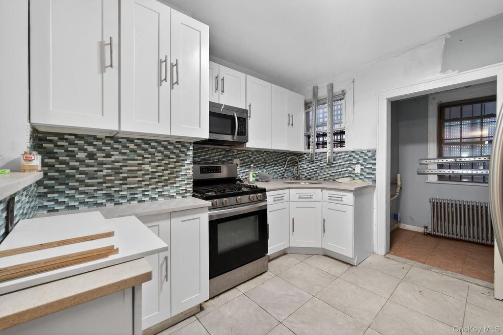 Photo of 10743 128th Street, Richmond Hill, NY 11419 (MLS # 965478)