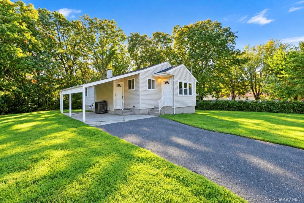 Photo of 384 Locust Street, Central Islip, NY 11722 (MLS # 1067058)