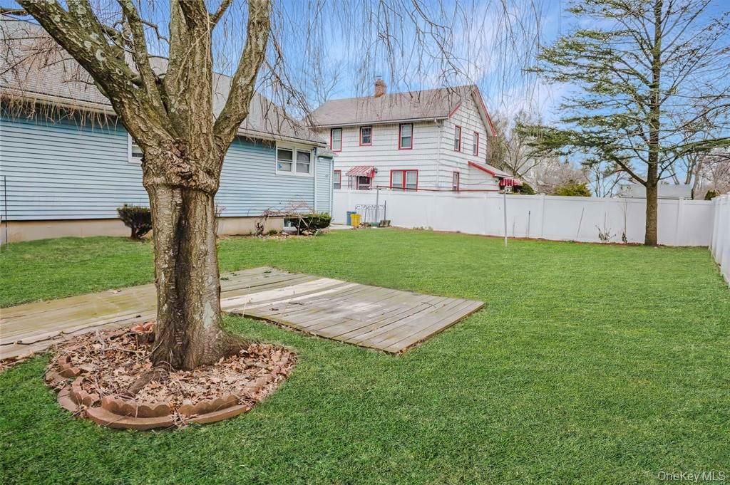 Photo of 241 Woodbury Road, Hicksville, NY 11801 (MLS # 948861)