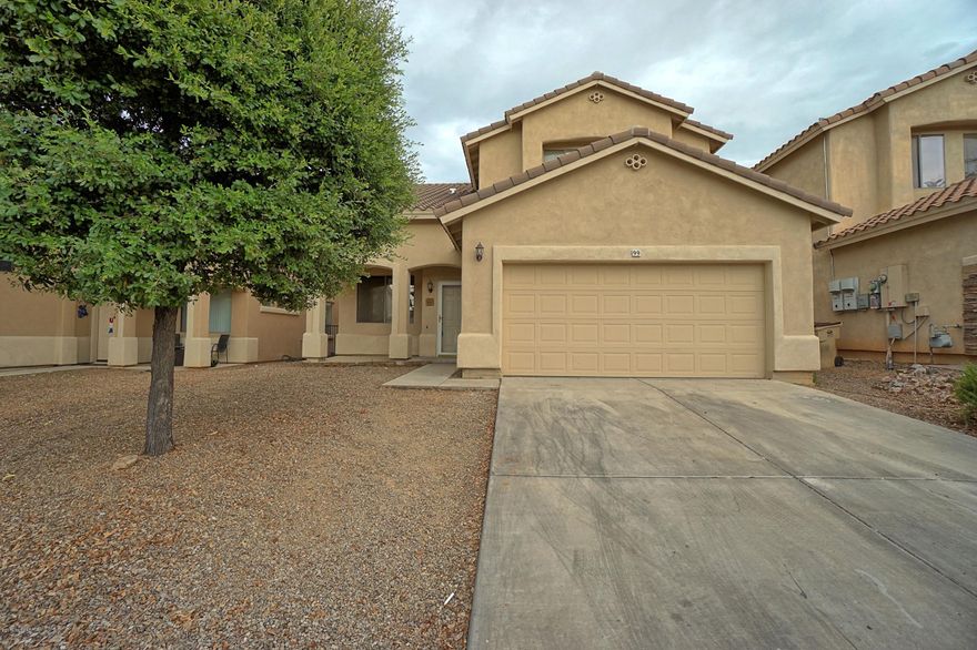 GREAT FIND! UPGRADES ARE EVIDENT IN THIS 2-STORY, 4 BEDROOM/3 BATH HOME. DOWNSTAIRS YOU'LL ENJOY 1 BEDROOM & BATHROOM, SOARING CEILINGS IN LIVING & DINING ROOM, LOTS OF CERAMIC TILE, $3K IN BEAUTIFUL CUSTOM WOOD BUILT-INS,
GORGEOUS KITCHEN W/ UPGRADED BACKSPLASH, SLIDEOUTS, & BLACK APPLIANCES.  TONS OF UPGRADED FLOORING STARTING WITH THE STAIRCASE, UPSTAIRS HAS 9' CEILINGS, LARGE MASTER SUITE/BATHROOM/WALK IN CLOSET, 2 ADDITIONAL BEDROOMS, 1 MORE BATHROOM & SPACIOUS LOFT THAT OVERLOOKS THE LIVING ROOM DOWNSTAIRS.  COMPLETE BACKYARD W/FULL-LENGTH COVERED PATIO, PLUS A CUSTOM EXTENDED COVER AND BRAND NEW GRASS. MOVE-IN AND ENJOY!