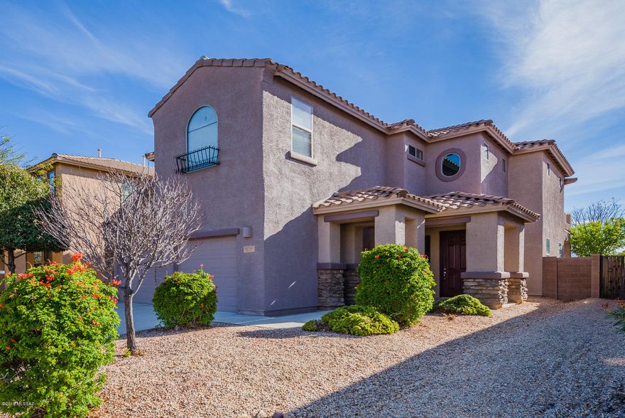 Great house in Rancho Del Lago. Beautiful curb appeal with stone brick facade and pillars at covered front patio. Open Floor Plan, ceramic tile and carpet. Remote controlled ceiling fans, dark granite kitchen countertops, island, breakfast bar, walk-in pantry, GE stainless steel appliances. Large laundry room w/ extended counter, oversized 2 car garage, two spaces for loft/office on 2nd floor w/spacious bedrooms, large Master w/balcony to enjoy great views of Rincon Mountains. Double walk-in closets and royal/master bath, extended covered patio with improved backyard to enjoy BBQ area.