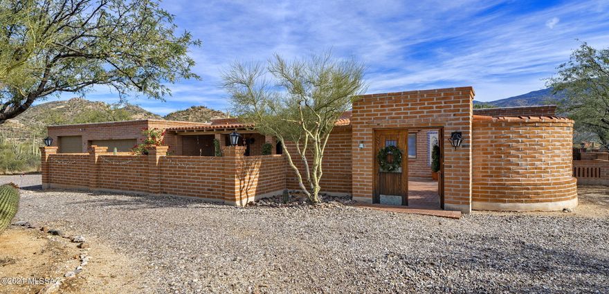 Charming Horse Property in La Cebadilla.
Beautiful burnt adobe home with architecturally matching four stall barn on 4.6 acres. Four bedrooms and three full bathrooms with a large enclosed courtyard for entertaining or private dinner parties. Kitchen features a five-burner gas range, double ovens and granite counters. Stunning backyard for entertaining guests with a sparkling pool, covered patio, lawn and breathtaking views. La Cebadilla Estates features a private lake for fishing and horse trails. This property creates a feeling of privacy and is only minutes away from Tucson's amenities.