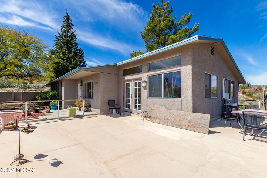VIEWS! VIEWS! VIEWS! Well-cared hillside home with impressive mountain views! Natural desert landscaping, 2-car garage & large space to park your RV with hookups. Relax on the large front deck while gazing at the stunning views! Discover a light & bright interior boasting wood-look flooring, modern ceiling fans, & brick-accented walls. Entertain your guests in the great room or the fabulous family room! The galley kitchen offers a pantry, cabinetry space, quartz counters, a farmhouse sink, pendant lighting, a plantation shutter in the window, & SS appliances. You'll love the main bedroom featuring backyard access, a spacious closet, a walk-in closet, & a private bathroom. Downstairs has a private guest suite with a full bathroom and private entrance. Enjoy the AZ weather all year round right in your Arizona room or relax in your own private fenced pool. Don't wait!