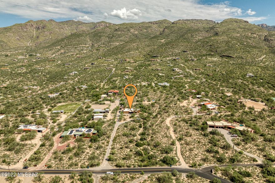 Motivated Sellers........

This custom home sits on 3.33 acres in the most desirable part of Tucson in the Tanque Verde Valley with peekaboo lights of the city. Located on the NE side of town with 360 degree views, homes like this are a rarity. Sets back from the road, this 2,666 square foot home provides privacy and serenity. Pulling up to the home, the circular driveway and fountain offers a welcoming site. The home itself includes a long list of upgrades including three completely remodeled bathrooms, several new windows and doors, new countertops, new flooring, and more! The 12-foot tongue and groove and exposed beam ceilings in the living and family rooms, connected by a central see-through stacked stone fireplace, give the feeling of being in a cozy lodge.

The covered patio provides close views of the Catalinas and a spectacular spot to watch the monsoons' role in. Sellers are offering concessions for interior paint to give you the opportunity to make the home your own. There is already ample cleared space on the property to add horse facilities, a shop, or whatever you might want. All of this is in the award winning Tanque Verde School District and close to trails, shopping, dining, and even golf! Don't wait, this home won't last long.