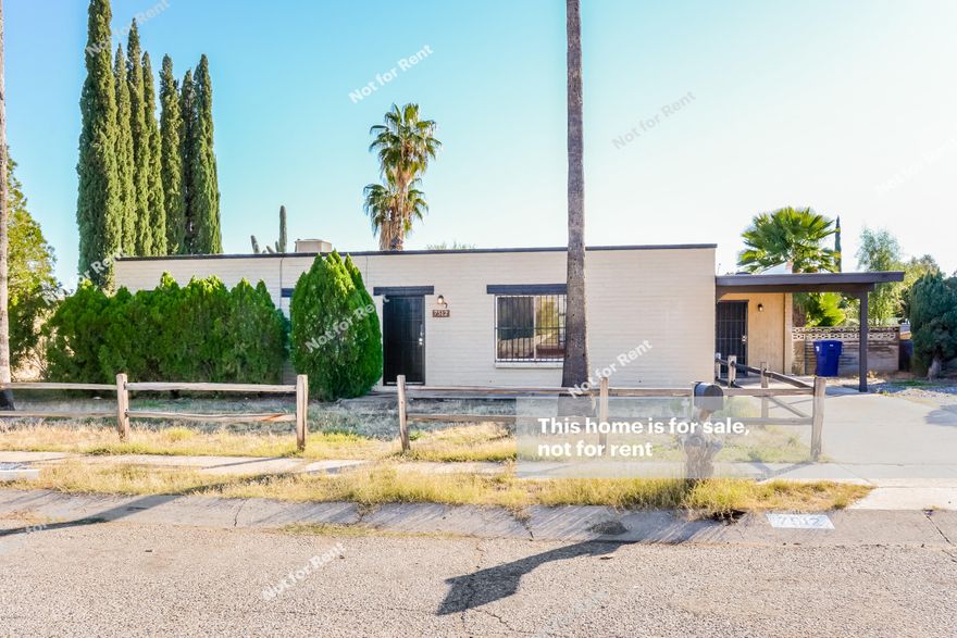 Built in 1970, this Tucson one-story home offers gas heating, stainless steel appliances, granite kitchen countertops, a tile-surround master shower, and off the street parking.