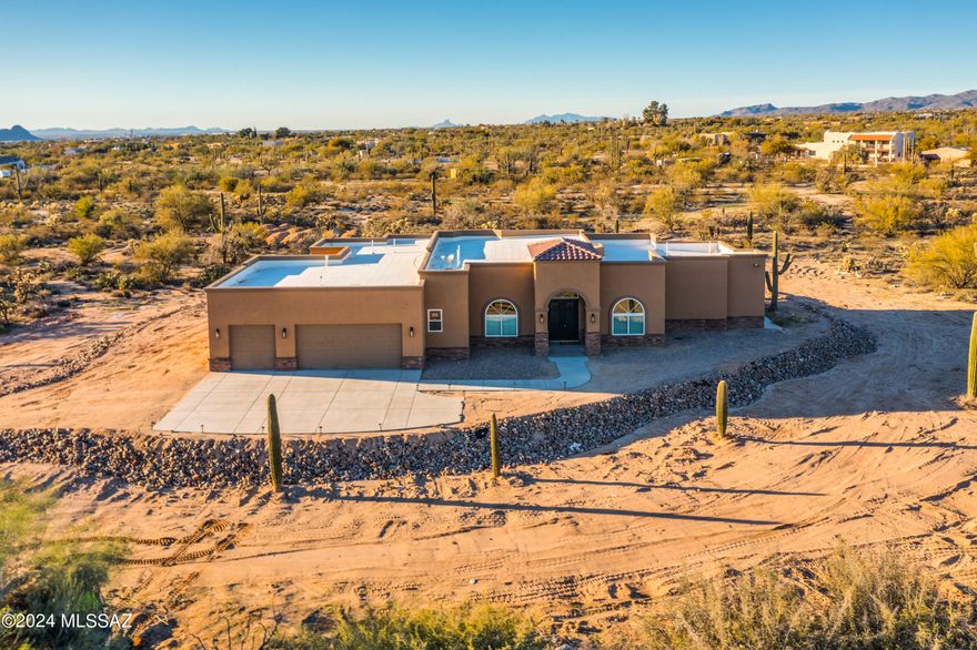 BRAND NEW majestic custom-built home on a 3.32 acre lot! This home boasts a great room with an upscale gourmet kitchen, spacious great room perfect for lounging around or serious entertaining! Formal dining area, and separate study right off great room with vaulted ceilings. Split floor plan with large bedrooms that will accommodate any size furniture. Your laundry room has plenty of space, a sink and cabinets for storage. VERY SPACIOUS 3-car garage. The exterior is a clear slate for your creativity and personalization where you will enjoy the plush Sonoran desert and our beautiful sunsets.