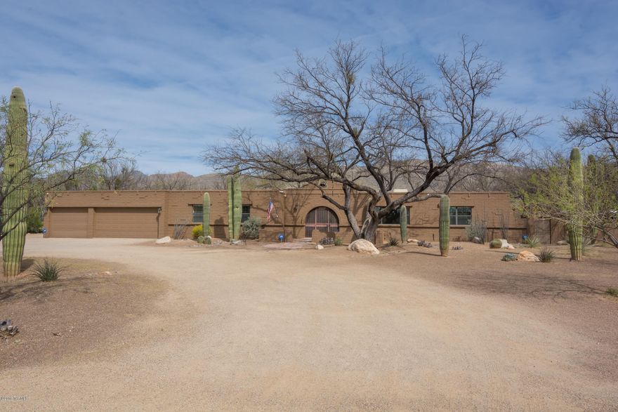 Heavily mesquited gorgeous mountain view lot. Dual Master Suites. Tastefully updated gourmet kitchen with stainless steel Kitchenaid appliances. Six burner gas stove , granite tops, and a Center island. Huge backyard with separate pool, spa, and artificial turf and fireplace with plenty of room behind wall for horses. Huge covered porch with 5 ceiling fans and built in BBQ. All Baths also have granite and travertine. Separate office with contemporary lighting, lots of built-ins and more granite surfaces plus approximately 17x24 hobby/studio. Only one step in entire home. Circular driveway, alarm, tank-less water heater and so much more.