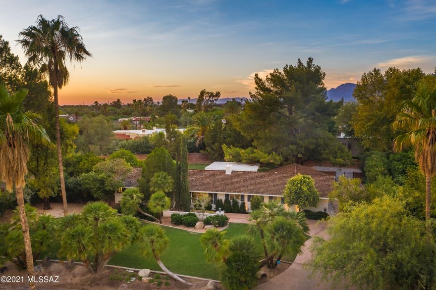 Nestled in the heart of El Encanto this home was elegantly updated & reconfigured in 2017 w/timeless features. Situated on a private lot w/mature landscaping, the sprawling grounds include a small citrus grove & large shade trees just steps away from the beautifully remodeled kitchen making dining alfresco under the ramada seamlessly easy. The kitchen is a cook's dream; Thermador gas oven/range, counter depth refrigerator, microwave drawer, quartz countertops & a chef's island w/seating. From the wall of windows, natural light abounds as you relax in the casual living area complete with gas fireplace.Bedrooms are ensuites; bathrooms were designed w/custom showers, cabinetry & title work.An office is perfectly situated for your ''work from home'' days or retreat. Surround sound inside and out.  Bathrooms have Bluetooth enabled lighting and sound from your device. Zoned HVAC installed during construction. Newer water heater. New duct system, recessed LED lighting, outlets with USB ports throughout. Please see the document tab for a thorough list of upgrades and improvements. 
This home has its own private well. No city water. No water bills.