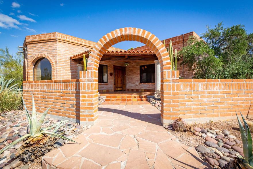 Views! Views! Views! ONE OF A KIND! Awesome Burnt Adobe Hacienda on gorgeous view lot in Catalina Foothills. Spectacular Great Room w/ soaring ceilings, custom wrought iron, stunning fireplace. Cozy Library/Den w/Custom concrete floors & huge city views. Gorgeous Master Suite w/ Stone pedestal sinks, Travertine. Amazing Guest House w/ flagstone , a separate kitchen & bath. Windows w/ forever mountain views, rooftop deck. Resort-like grounds w/pool, secluded patios, outdoor BBQ & fireplace. A GEM!!