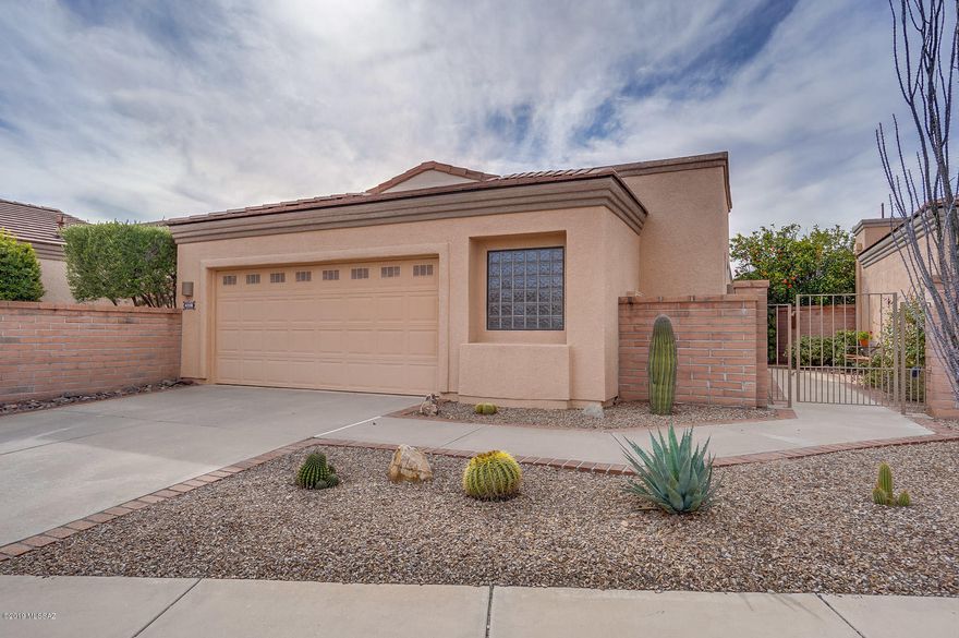 This lovely home has been meticulously cared for and has desirable upgrades and features throughout.  This gorgeous gem features a soothing neutral color palate and stunning porcelain tile floors with custom inlays.  The kitchen offers quartz counter tops, warm birch cabinets and lustrous black appliances.  Unwind from a long day of play watching the beautiful Arizona sun set from your cozy kitchen nook.  The master suite offers dual sinks, crisp quarts counters, an updated tile shower and two nice sized closets.  The guest suite offers privacy and luxury with stunning quartz counters and functional pocket door and views of the stunning courtyard entry.  This is a must see, move-in-ready home with furniture and decor available via separate bill of sale.