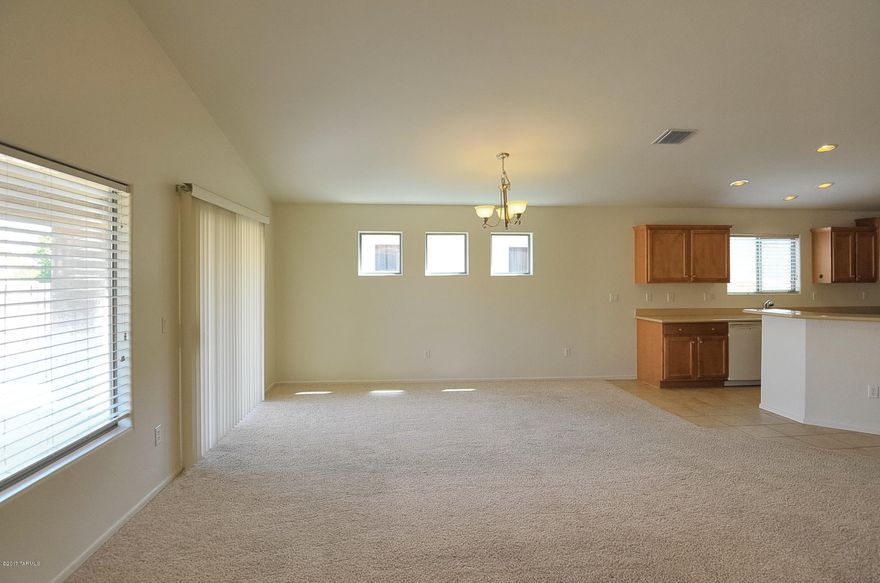 Beautiful 3 bedroom, 2 bath home in Valencia Reserve. Open and bright home with fresh paint, clean tile and carpets, Spacious open kitchen with loads of cabinets, breakfast bar or eat in area, plenty or room for entertaining, bisque colored appliances include side by side  refrigerator, microwave, oven dishwasher all opens to large great room.  Large pantry, split floor plan master has double vanities, separate tub/shower, large walk in closet, ceiling fan, laundry room with white washer/dryer , large covered rear private back yard, 2 car garage with door that leads to rear yard.  Close to DMAFB, Raytheon, Airport, easy access to I-10.  Subject to application process and credit approval.  This home has it. Ask about P#3190