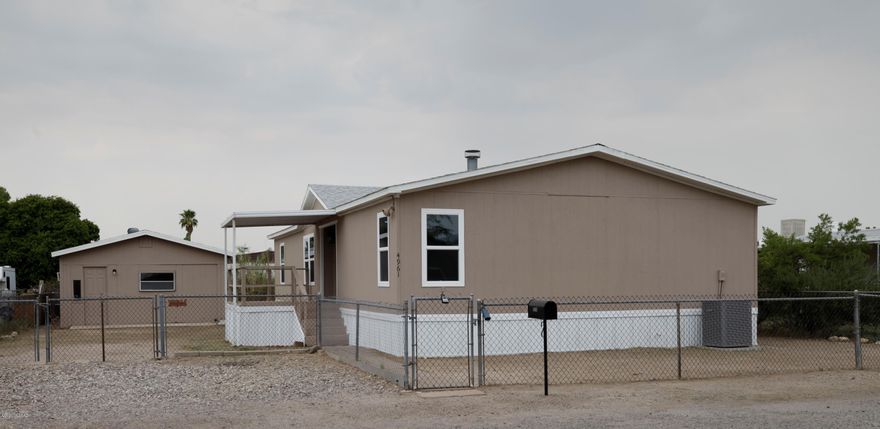 Updated 3 bedroom, 2 bathroom manufactured home. Freshly painted inside and out. Remodeled kitchen and bathrooms with granite counter tops in kitchen. New cabinets throughout. New carpet in bedrooms. New HVAC and water heater.  Very recent roof.  Lots of space and large lot. Extra out building for shop or storage.  Lots of space for rv or boat. Financing is VA or non standard conventional.  Owner will consider a carryback with 20% down, 6% interest and a 5-7 year stop.   owner/agent