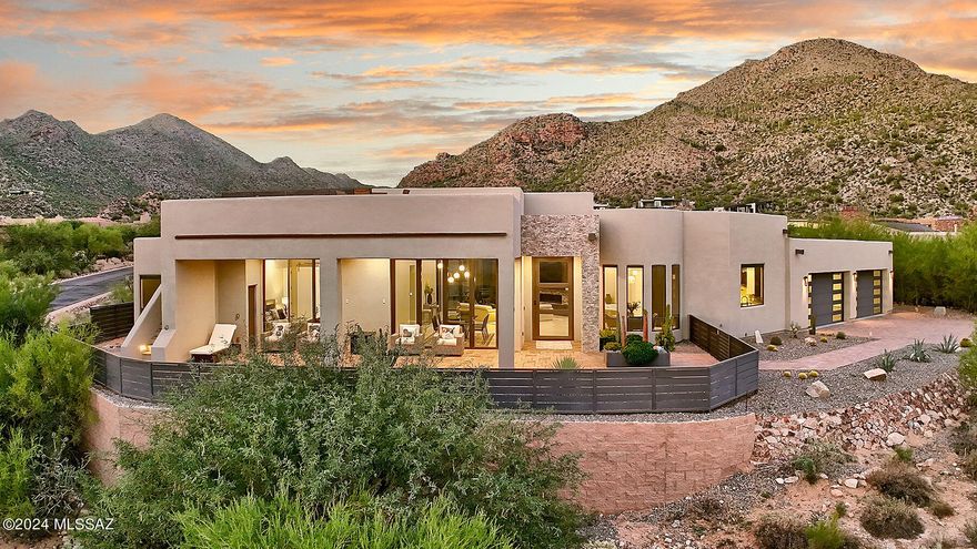 Furnished upscale resort-style living in the heart of Dove Mtn! Behind staffed gatehouse of Canyon Pass & 2nd gate of exclusive Vaqueros enclave, sits this like-new 2020 contemporary custom. 4 bdrm/5 baths (all ensuite) + office.  Includes Copenhagen furniture collection + $20k audio/TV pkg & $30k electric blinds. Affords immediate luxurious living. 4 championship golf courses - The Ritz Carlton & The Gallery, social clubs & hiking trail w/i minutes. Features: Panoramic stunning city & lush mtn views. Cascading pool/spa, roof view deck, gated front courtyard, energy efficient window tint, linear fireplace. Modern, open gourmet kitchen, spacious rooms, 4 car garage. Master wing - split floor plan & high ceilings. No steps or carpet. The finest indoor/outdoor living w/ privacy & serenity