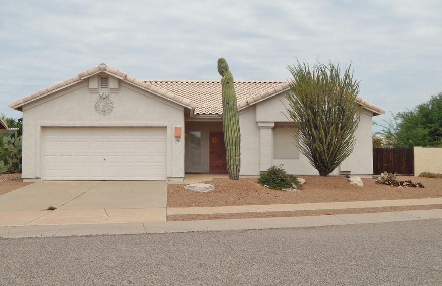 Pride of ownership abounds in this Rita Ranch gem! The home is move in ready and includes all appliances. Title flooring in all the common areas with carpeting in the spacious bedrooms. The master suite has a walk in closet and dual sinks and separate tub and shower in the bath. The kitchen has an eat in dining area and large pantry. The large back yard is fully landscaped and features a full length covered patio. Behind the home is a drainage way (wash) providing extra privacy. Most of the furnishings are available for sale on a separate bill of sale. This one will not last long!