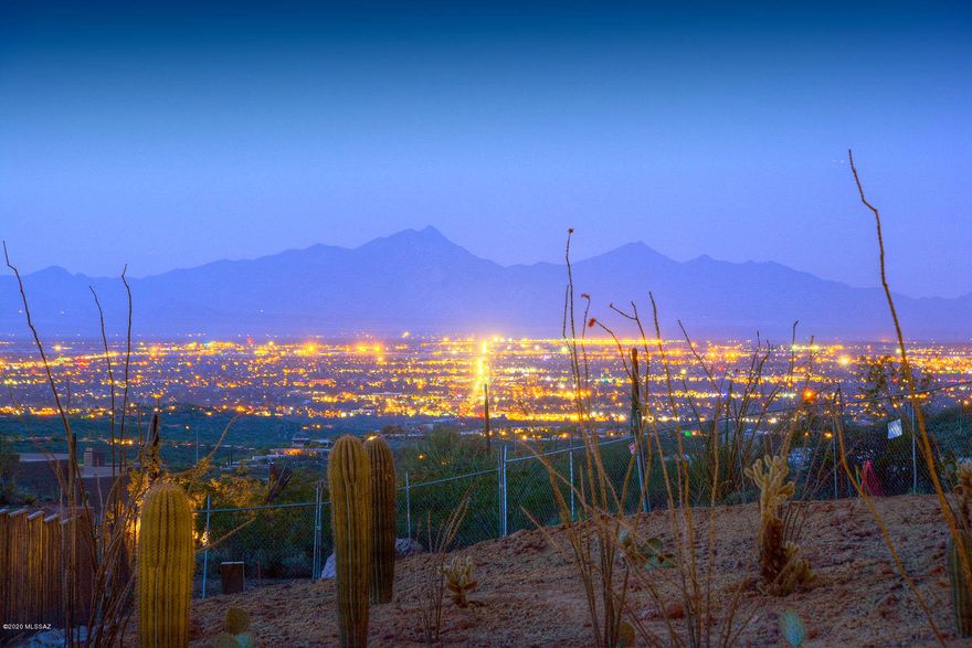 Outstanding, brand new contemporary-style home in prestigious, gated Finisterra.  Stunning does not being to describe this 6 bedroom, 5 ½ bath, 6,000 sq. ft. masterpiece at the top of a ridge, at the end of a cul-de-sac, on a 2.16 acre lot with privacy, sweeping Ventana Canyon, Catalina and Rincon mountain and Tucson city views.  Paver driveway leads to custom wrought iron entry door into living room/dining room with soaring ceilings, walls of windows, custom light fixtures, natural stone floors and alder wood doors throughout. Family room and chef's kitchen offer granite counters, SS designer appliances, oversized center island and custom cabinetry. The home is currently under construction and will be completed soon, buy now and select some of your own finishes.
