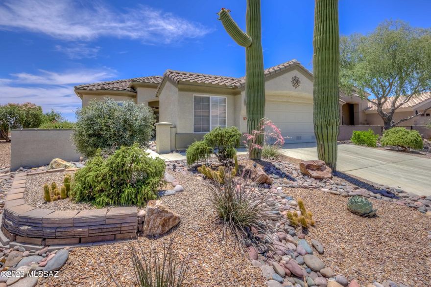 Beautiful Home with BOTH City & Mountain Views Overlooking the Top Rated Golf Course! The Highlands at Dove Mountain is a breathtaking active resort-style 50+ community! Expanded Carson Model offers spacious Great Rm layout w/built-in entertainment center & surround sound system. Home features oversized diagonal set tile, neutral carpet, Bay windows, plantation shutters thru-out, fresh interior/exterior paint, water softener & RO filter, lrg Laundry Rm w/lots of storage, garage w/golf cart space & more. Open Kitchen has Corian counters, new stainless appliances, bar seating & shelved pantry. Separate Breakfast Area & Dining Room. Master Suite has amazing views, walk-in closet & dual sink vanity. Elevated backyard offers covered patio, gas BBQ island, flagstone deck, Spa & stunning views!